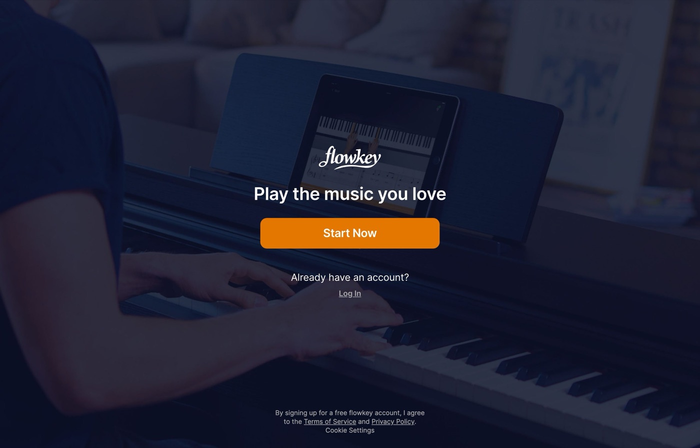 The flowkey web app lesson player: hands playing a piano keyboard with synced notation